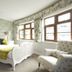 Exmoor White Horse Inn guest room in Minehead with floral wallpaper, white bed, and armchair