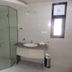 Ganga Beach Resort in Rishikesh bathroom with glass shower enclosure and marble vanity