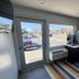 Motel 6 Ontario Airport lobby with glass entrance doors and street view in Ontario