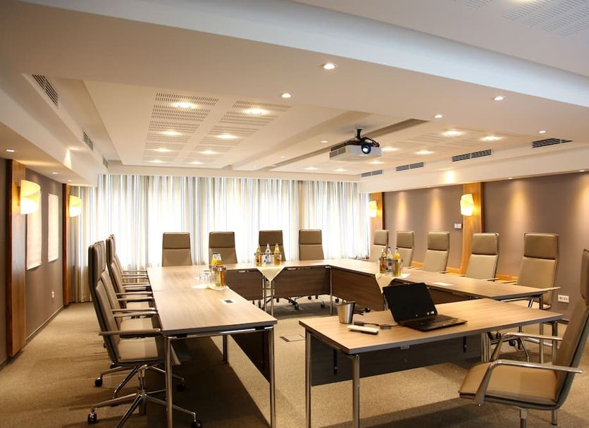 Flair Hotel Nieder Bestwig conference room with U-shaped table and office chairs