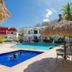 Azul Sirena in Santa Maria Huatulco with pool, thatched palapa seating and tropical courtyard