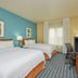 Fairfield Inn & Suites by Marriott Burlington guest room with two beds and window view