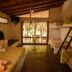 La Casa de Sebas, Máncora: simple dorm room with bunks and sliding doors to a patio