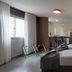 Lym Flat Hotel in Uberlândia room with two beds, window, and small dining area