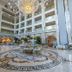 Amara Dolce Vita Luxury in Tekirova lobby atrium with ornate chandelier, marble floors and seating