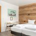 Stay Apartments Einholt Reykjavik room with twin beds and wood accent wall