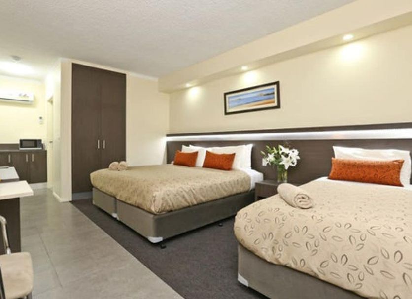 Morphettville Motor Inn Adelaide guest room with two beds and kitchenette