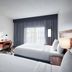 Courtyard by Marriott Kansas City Overland Park/Metcalf guest room with two beds, TV and desk in Overland Park
