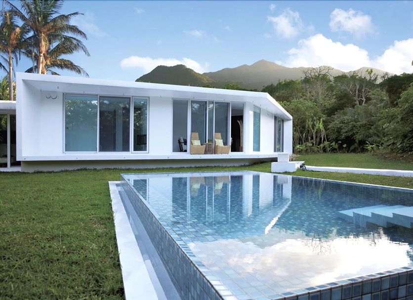 Jusandi, Ishigaki: modern villa with private pool, lawn, and mountain backdrop