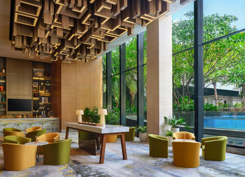 Four Points by Sheraton Surabaya, Tunjungan Plaza lounge with floor-to-ceiling windows and pool view