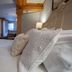 5 Ojo Inn Bed & Breakfast in Eureka Springs guest room with four-poster bed and plush pillows
