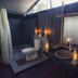 The Beach Camp Yala in Kirinda: open-air tent bathroom with toilet, sink, mirror, and lanterns