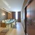 Thotel Lamezia in Feroleto Antico meeting room with long glass table, chairs, and wall art