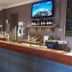 Dongara Hotel Motel bar and lounge area in Dongara with TV, bottles, and wooden counter