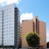 Toyoko Inn Narita Airport Honkan in Narita, exterior of high-rise hotel buildings under a blue sky