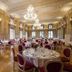 Grand Hotel des Bains in Lavey-Morcles ornate banquet hall with chandeliers and set dining tables