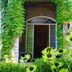 Gatekeeper's Retreat in Niagara-on-the-Lake: ivy-covered stone entryway with arched doorway and garden