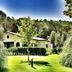Montebelli Agriturismo & Country Hotel in Grosseto with garden, trees and a country house exterior