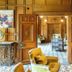 The Wood Norton in Evesham, wood-paneled hotel entrance with open doors to a patterned lounge