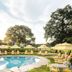 Commodore Perry Estate, Auberge Collection in Austin with a poolside terrace and yellow striped loungers