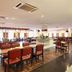 The Putra Regency Hotel in Kangar dining room with tables, chairs, buffet counters and polished floors