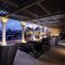 Chillax Resort Bangkok rooftop terrace with lounge chairs and city view at dusk