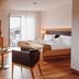 Hotel & Restaurant Goldener Pflug, Ludwigsburg room with bed, seating area and balcony view
