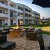 Courtyard by Marriott Chicago Waukegan/Gurnee courtyard with fire pit, seating and hotel rooms in Waukegan