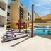 Juweira Boutique Hotel Salalah adults-only pool deck with cabanas and ocean view