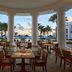 JW Marriott St. Maarten Beach Resort & Spa terrace dining with palm trees, pool and ocean view