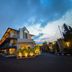 Hotel Nyland Pasteur Bandung exterior at dusk with lit entrance and modern facade in Bandung