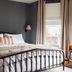 The Preston House and Hotel in Riverhead, guest room with black metal bed frame and window view
