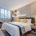 Home Inn Style Shanghai Dahua Xincun Road Metro Station guest room with city-view window and modern bed
