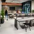 The Social Hub Amsterdam City meeting space with tables, chairs and lounge seating in Amsterdam