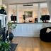 Emerson Inn By The Sea lobby with fireplace, wood floors, and seating in Rockport