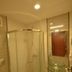 Kosk Sivas bathroom with glass shower enclosure and round wall-mounted sink