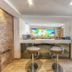 Ddream Hotel St. Julian's lobby bar with stools and colorful wall art