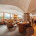 Hotel Bergjuwel in Neustift im Stubaital lounge with arched ceilings, stone fireplace and seating area