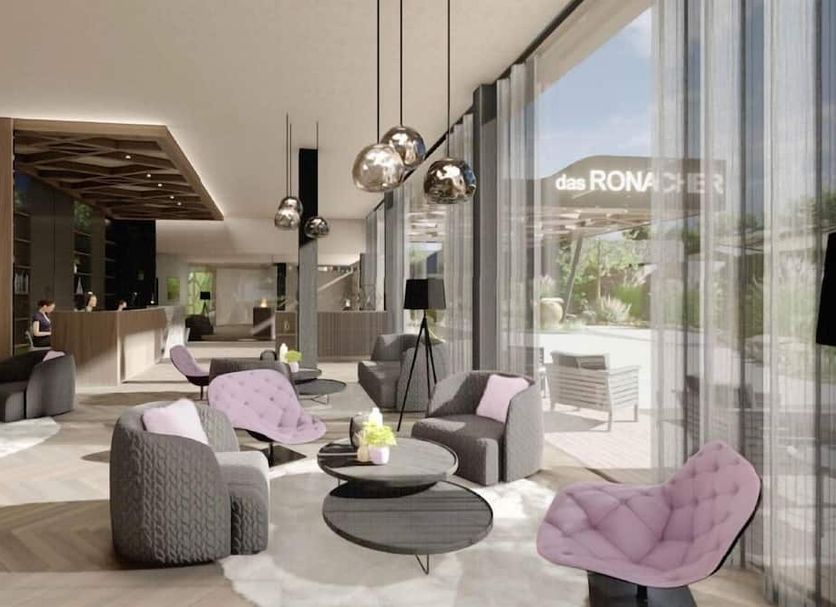 The New Ronacher Thermal Spa Hotel in Bad Kleinkirchheim lounge with floor-to-ceiling windows and mountain view
