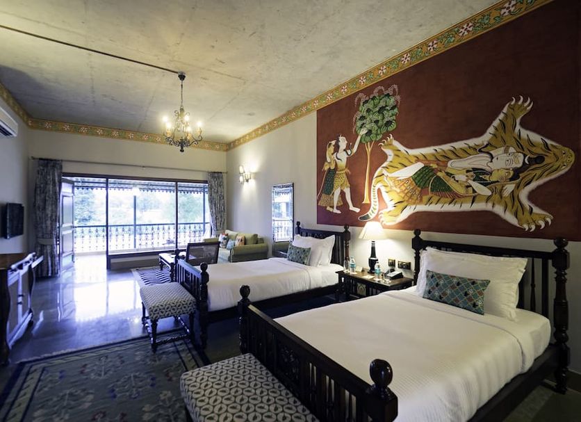 Tree of Life Resort & Spa Varanasi guest room with twin beds and balcony view