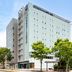Comfort Hotel Narita in Narita exterior with multi-story facade and trees along the street