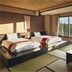 Aomoriya by Hoshino Resorts in Misawa with tatami room, futon beds, and large window overlooking greenery