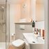 greet Hôtel Prévessin Genève Aéroport bathroom with shower, toilet and sink in Prévessin-Moëns