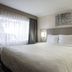 Hotel Aspen Flagstaff/ Grand Canyon Innsuites guest room with king bed and window view in Flagstaff