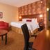 Courtyard by Marriott Dulles Airport Herndon/Reston guest room with sofa, bed, and desk in Herndon