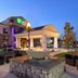 Holiday Inn Express & Suites Colorado Springs-First & Main entrance with fire pit seating at dusk