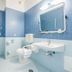Europa Stabia Hotel bathroom in Castellammare di Stabia with blue tile, tub, toilet and sink