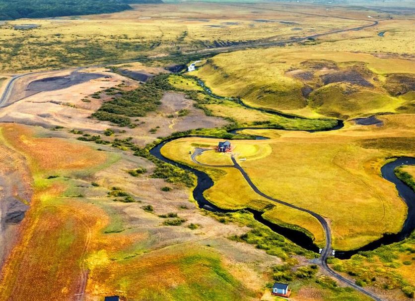 Afternoon Cottages in Hella with sweeping aerial views of colorful fields and a winding river