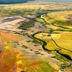 Afternoon Cottages in Hella with sweeping aerial views of colorful fields and a winding river