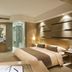 Hengshan Garden Hotel in Shanghai guest room with king bed, bathtub and glass shower